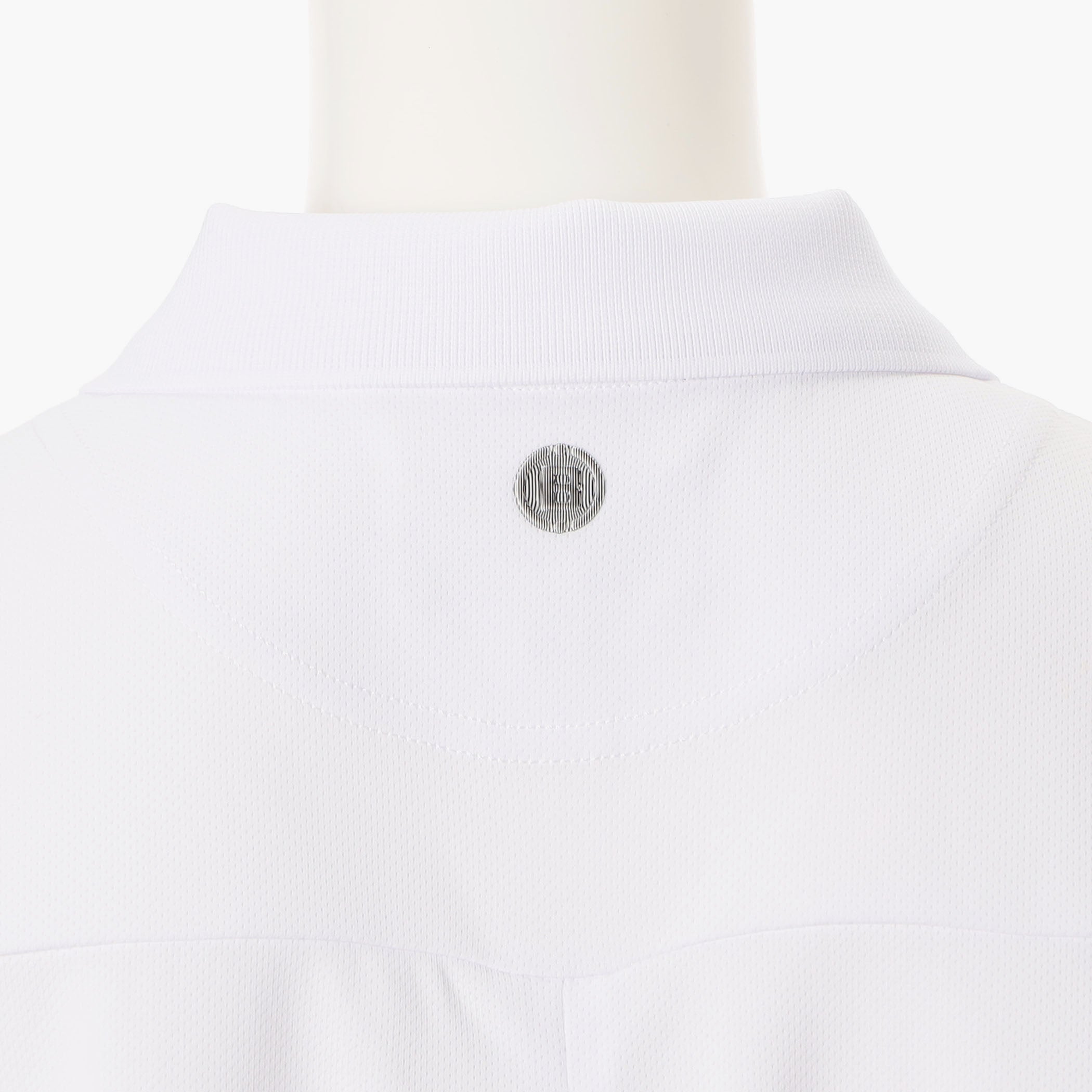 WOMEN’S BACK FLARE POLO